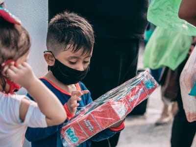 In true Moz-style lingo, we've got a duo of remarkable youths making waves. Mask-clad and armed with potentially transformative boxes, these audacious trailblazers are hell-bent on igniting empowerment. Their target audience: the oft-overlooked, yet surprisingly powerful cadre of hard-of-hearing peers. These entrepreneurial firebrands aren't just joining the ranks - they're redefining them. Let's retune our perspectives to their new frequency and throw a supportive nod their way!