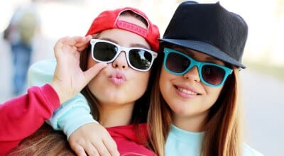 Check this out, folks - a snapshot capturing the essence of youthful exuberance and resilience. Here we have a duo of young ladies, helmets on heads, sunglasses casting an air of coolness, striking their poses for the lens. The subtle way it underscores their fortitude reminds us all that being hard-of-hearing doesn't bar you from living life with sass and style. Proud to support these spirited souls through our foundation’s endeavors. Remember, every single one can make waves - hearing or hard-of-hearing notwithstanding!