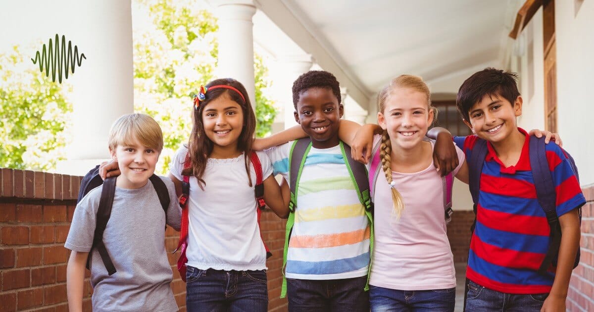 Imagine five kids, backpacks slung over their shoulders, united in a sunlit corridor. Their smiles say it all - at "aac-for-hoh-children," we build more than just communication skills; we cultivate community and uplift HOH youth together. This is where friendships form and confidence grows, all while fostering an inclusive and supportive environment.